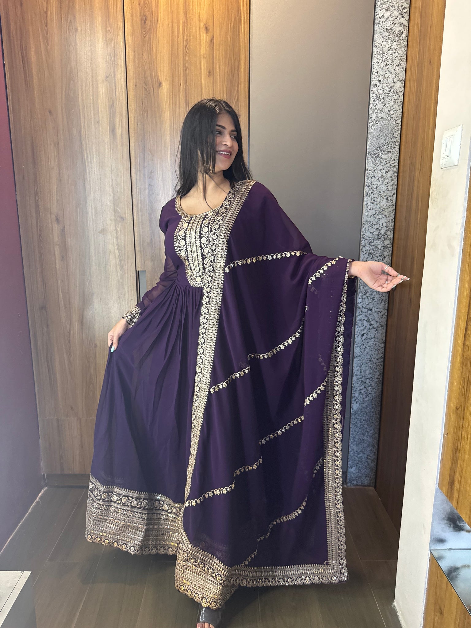 ANCHOR VISHWA PANDYA IN PURPLE COLOR FAUX BLOOMING RICH SEQUENCE EMBROIDERED GOWN