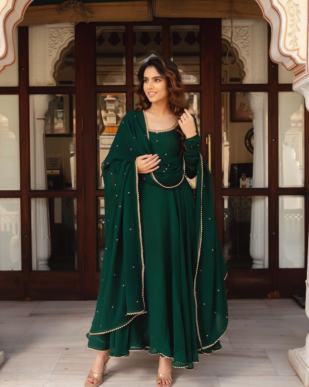 GREEN COLOR SOFT GEORGETTE WITH SEQUENCE FULLY FLAIR ANARKALI SUIT