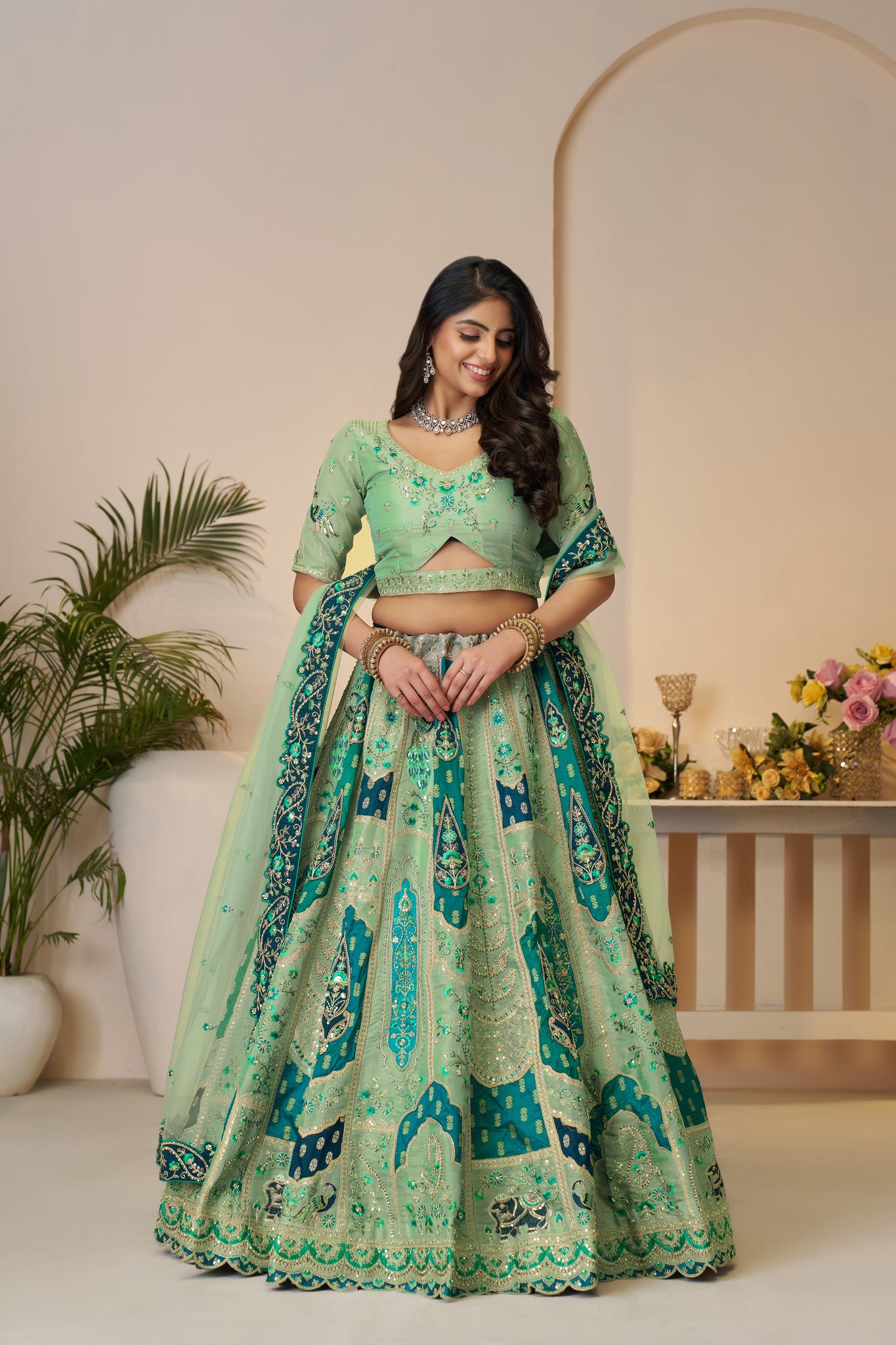 THE RAJSI HAATHI COLLECTION – GRACEFUL GREEN BRIDAL LEHENGA WITH PEACOCK & ELEPHANT MOTIFS