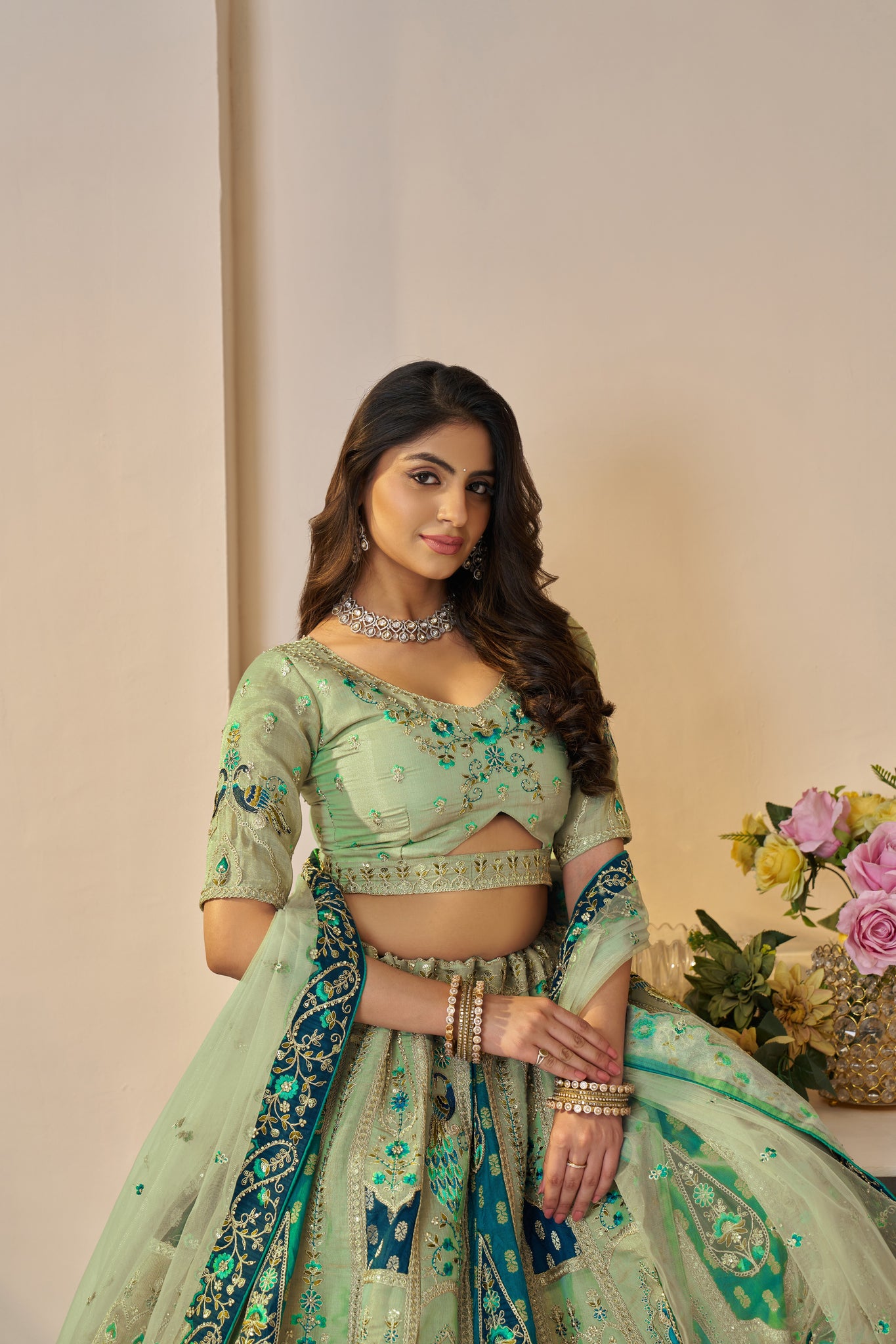 THE RAJSI HAATHI COLLECTION – GRACEFUL GREEN BRIDAL LEHENGA WITH PEACOCK & ELEPHANT MOTIFS